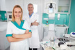 © luckybusiness - Portrait of dental assistant with dentist in dental clinic