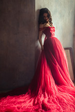 Portrait Of Sensual Woman In A Long Gorgeous Red Dress