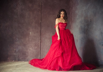 portrait of sensual woman in a long gorgeous red dress