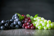 Colorful Grape On Wooden Board Dark Background Copy Space