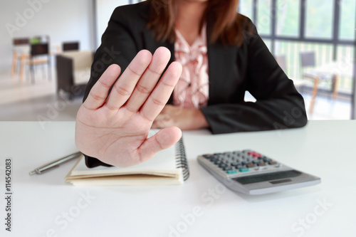 Fotografija Businesswoman says no or hold on at her office