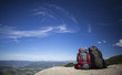 © Vitalii Nesterchuk - Backpack on a mountain top.