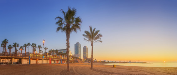 Wall Mural - barceloneta beach in barcelona at sunrise