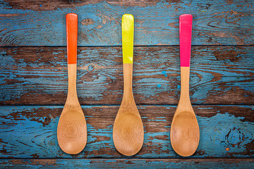 Wall Mural - Colored wooden kitchen spoons. Accessories for cooking.