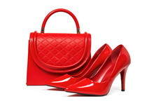 Red Female Leather Shoes And Red Leather Bag On White Background