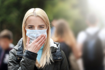 Woman in protective mask outdoors