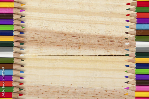 Fototapeta na wymiar Wooden background with colouring pencil edges