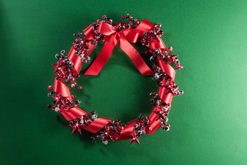 Wall Mural - Christmas wreath in red with ribbon