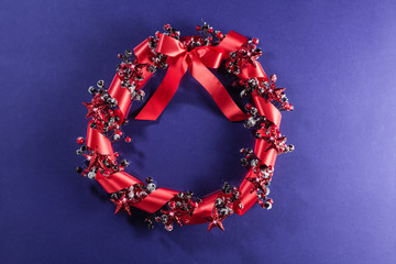 Wall Mural - Christmas wreath in red with ribbon