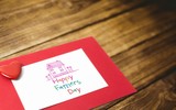 Fototapeta Paryż - Composite image of word happy fathers day and drawn pink house