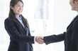 © Monet - Business women are shaking hands in the office