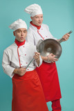 Fototapeta Koty - Men cook in caps