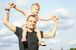 © snedorez - son on the shoulders of his father