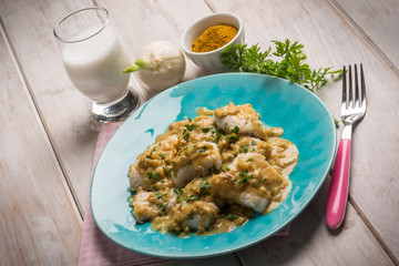 Wall Mural - fillet fish with coconut milk and curry sauce