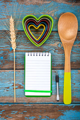 Wall Mural - Set kitchen utensils and a notebook for recipes