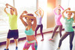 © Syda Productions - group of smiling people dancing in gym or studio