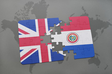 puzzle with the national flag of great britain and paraguay on a world map background.