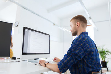 creative man or programmer with computer at office