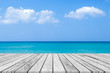 blur sea beach background with white wooden floor board.