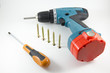 © Andrei_Chuzhinov - Cordless screwdriver, screwdriver and screws on a white background