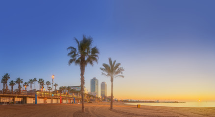 Wall Mural - barceloneta beach in barcelona at sunrise