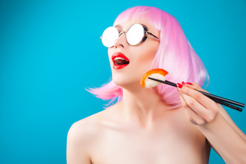 Beautiful girl with red lips and pink hair