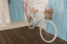 White And Blue Vintage Bicycle With Flowers In A Basket