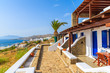 Traditional holiday apartments and view of Mykonos town on coast of Mykonos island, Cyclades, Greece