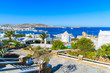 A view of Mykonos port and town from coastal promenade, island of Mykonos, Cyclades, Greece