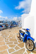 NAOUSSA PORT, PAROS ISLAND - MAY 18, 2016: Old scooter parked in Naoussa port on Paros island, Cyclades, Greece