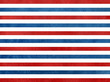 © perekotypole - Watercolor dark blue and red striped background.