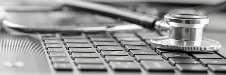 Stethoscope on a computer keyboard