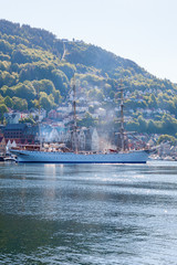 Canvas Print - Bergen harbor in Norway with a sailing ship