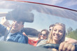 © Syda Productions - happy friends driving in cabriolet car