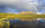 Fototapeta Tęcza - Rainbow over a mountain lake