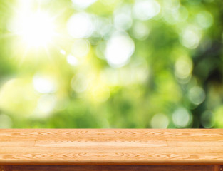 Aufkleber - Empty brown wood table top with green blur nature sun light,Mock