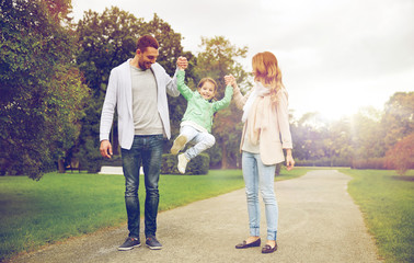 Wall Mural - happy family walking in summer park and having fun