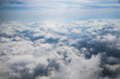 © otaraev74 - Clouds, sun and sky as seen in window of an aircraft