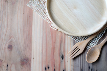 Wall Mural - The wooden plate on a wood table