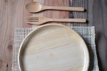 The wooden plate on a wood table