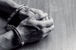 © BortN66 - hands in handcuffs