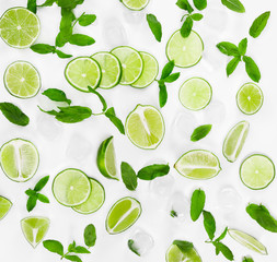  Limes, fresh mint and ice for mojito on white background.