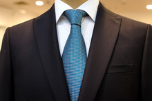 Black Business Suit With A White Shirt And With A Blue Tie In Drawing