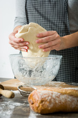 Wall Mural - Woman making bread with her hands

