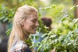 © WavebreakmediaMicro - Female gardener examining plants
