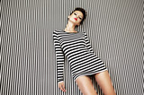 Fototapeta  - fashion woman in striped dress on  background