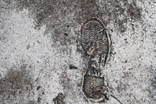 Foot Print On Grunge Concrete Texture
