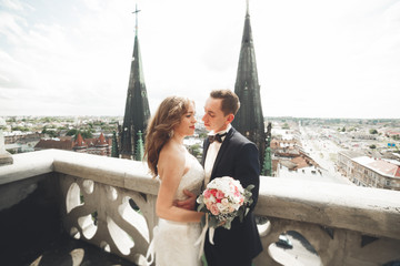 Gorgeous wedding couple walking in the old city of Lviv