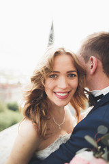 Gorgeous wedding couple walking in the old city of Lviv