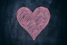 Pink Heart Shape On Black Chalkboard Background